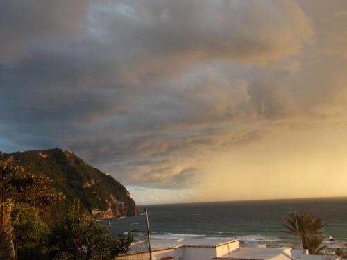 a view of the ocean with a cloudy sky at Villa Loreta in Ischia
