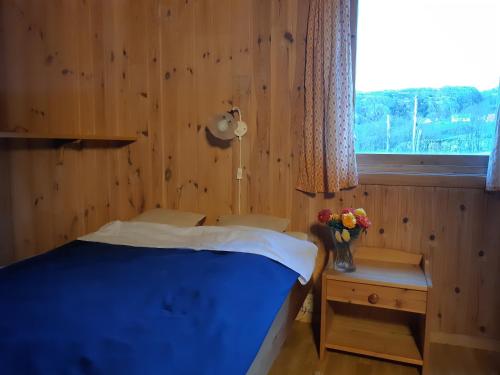 Tempat tidur dalam kamar di Hytte ved Preikestolen