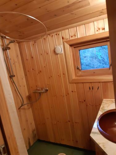 a bathroom with a sink and a window at Hytte ved Preikestolen in Forsand