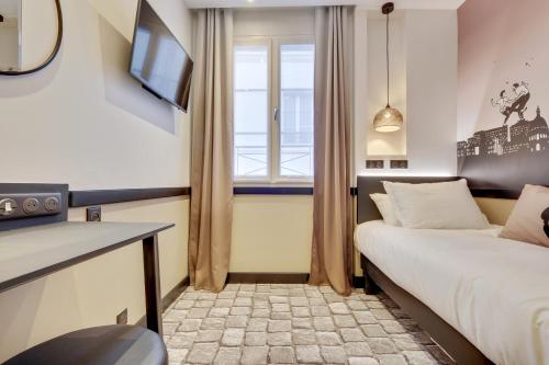 a hotel room with a bed and a window at Hôtel Lucien & Marinette in Paris