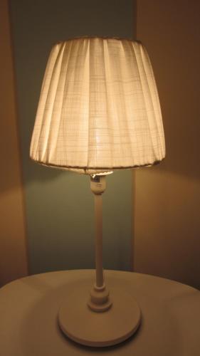 a lamp sitting on top of a table at Cascina Bellezza in Poirino