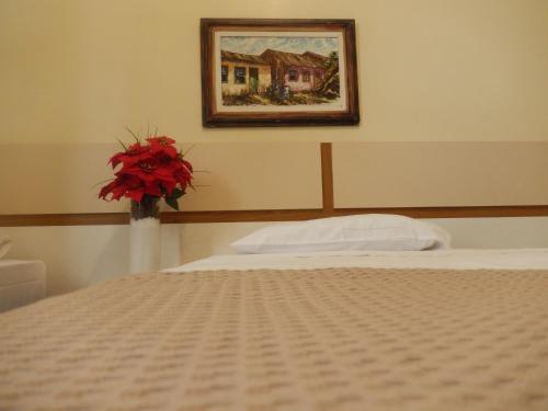 En eller flere senge i et værelse på Hotel Metropole