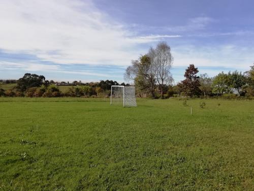 a soccer field with a goal in a field at Casa El Prado de la Romia in Argüero