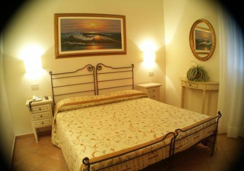 Ένα ή περισσότερα κρεβάτια σε δωμάτιο στο Residence Isola Verde Cisanello