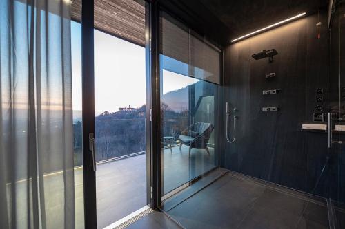 a room with sliding glass doors and a balcony at Phi Hotel Piajo in Nembro