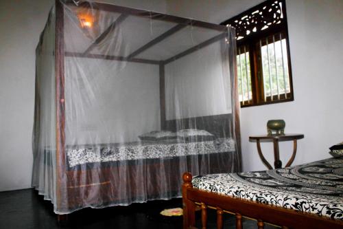 Ένα ή περισσότερα κρεβάτια σε δωμάτιο στο Shantha Surf Villa