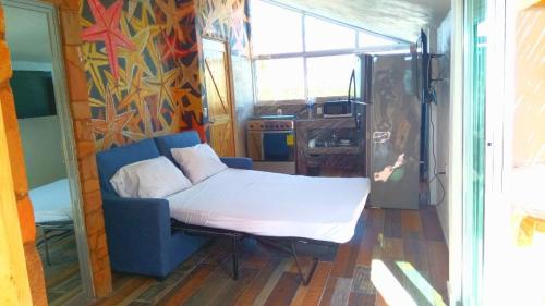 Ένα ή περισσότερα κρεβάτια σε δωμάτιο στο Hotelito Escondido