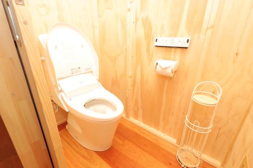 a bathroom with a toilet in a small room at JR Mobile Inn Sapporo kotoni in Sapporo