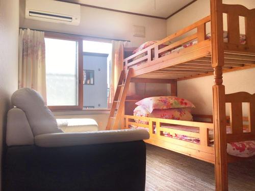 Postel nebo postele na pokoji v ubytování Kien