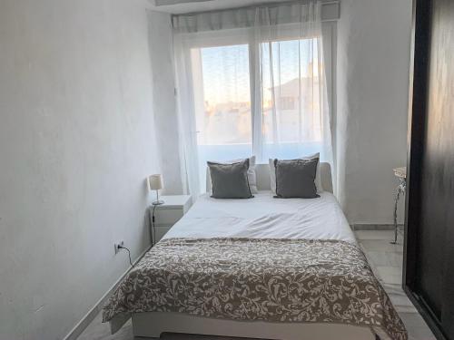 Ліжко або ліжка в номері Apartament Benalmadena Marina SOL