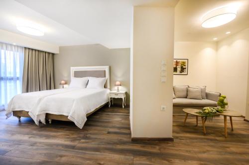 A bed or beds in a room at Emerald Suites