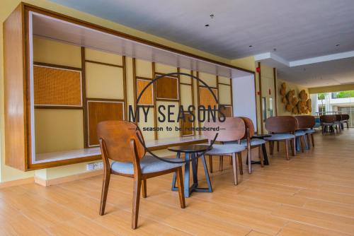 a row of tables and chairs in a waiting room at Timurbay by My Seasons in Kuantan