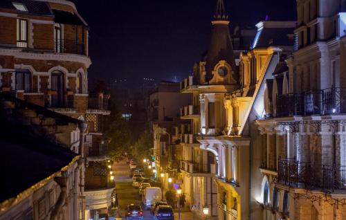 a view of a city street at night at Hotel Belvedere in Batumi