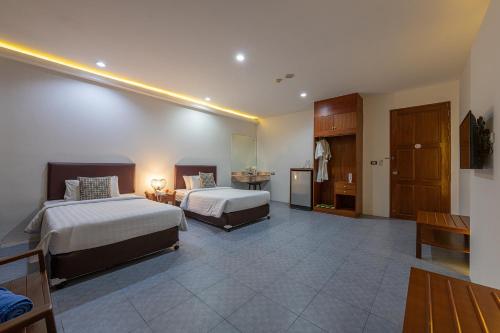 Katil atau katil-katil dalam bilik di Blue Beach Apartment