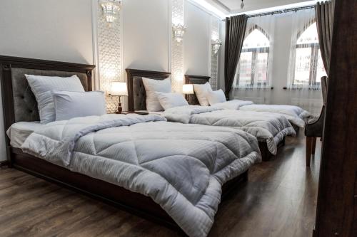 Ένα ή περισσότερα κρεβάτια σε δωμάτιο στο Hotel Minor