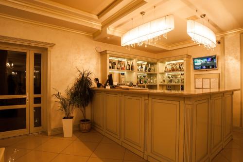 a bar in a large room with at Maria Garden hotel & restaurant in Ivano-Frankivsʼk
