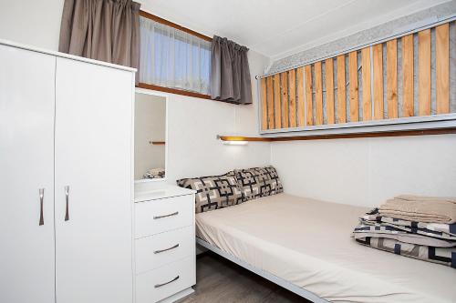 En eller flere senge i et værelse på Great Ocean Road Tourist Park