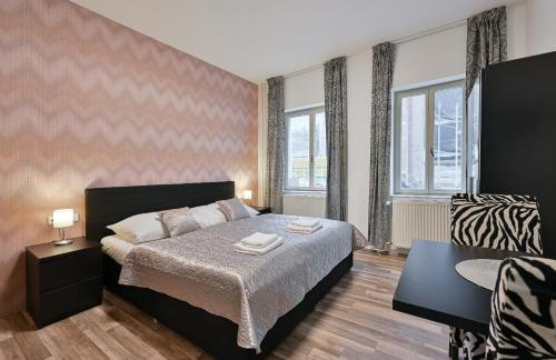 Postel nebo postele na pokoji v ubytování Rabie Aparthotel