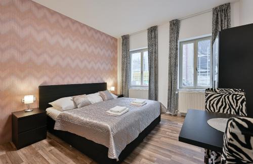 Posteľ alebo postele v izbe v ubytovaní Rabie Aparthotel