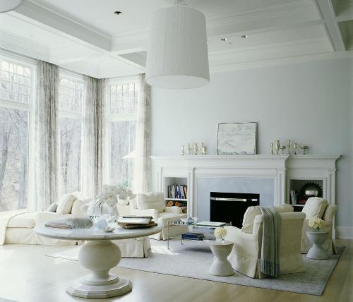 a living room with white furniture and a fireplace at The Mayflower Inn & Spa, Auberge Collection in Washington