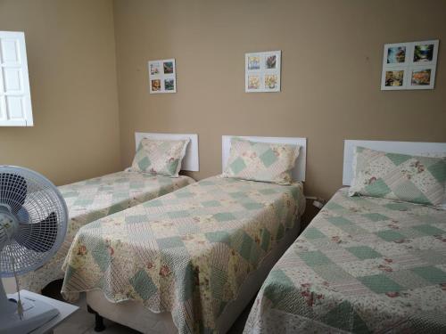 Un ou plusieurs lits dans un hébergement de l'établissement CASA DA MONTANHA na Chácara Paraíso