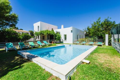 a swimming pool in the backyard of a house at Villa 715 - our Albufeira holiday retreat in Albufeira