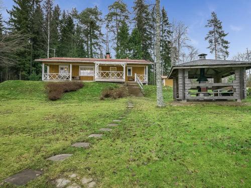 a house on a hill with a gazebo at Holiday Home Villa siesta by Interhome in Torvoila