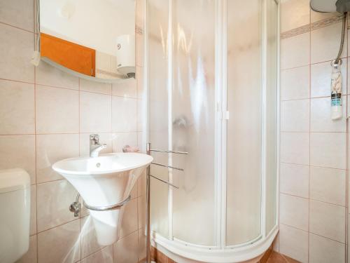 a bathroom with a shower and a sink at Holiday Home Mila by Interhome in Kras