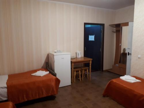 Postel nebo postele na pokoji v ubytování Hotel Gostynnyi Dvir