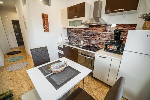 Kuchyň nebo kuchyňský kout v ubytování Apartment A1