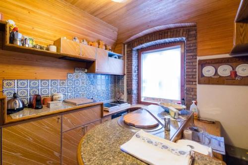 a kitchen with a sink and a counter top at 6 Ponterosso - Luxury Attic in Trieste