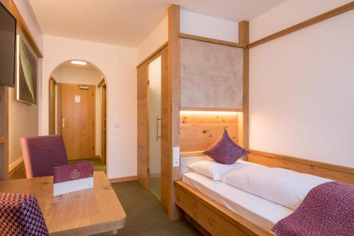 Postel nebo postele na pokoji v ubytování Posthotel Lamm