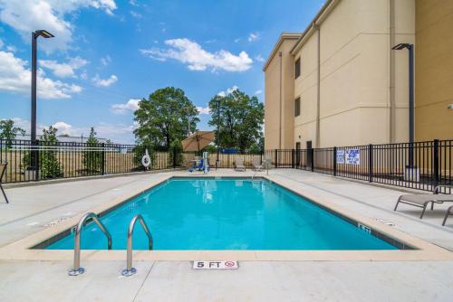 a swimming pool in front of a building at Comfort Inn & Suites in Rock Hill