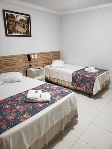 Кровать или кровати в номере Euro Plaza Hotel - Próximo ao Aeroporto de Goiânia, Santa Genoveva