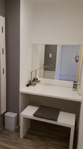a bathroom with a sink and a mirror at Ferienwohnungen Fuchs in Duisburg