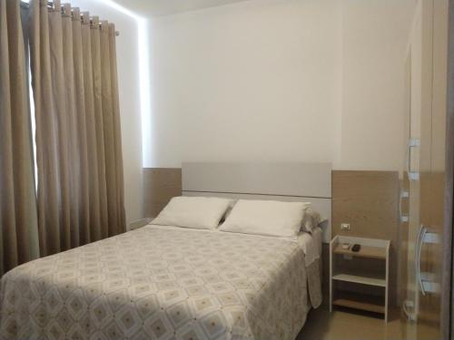 Кровать или кровати в номере Natalina Residencial - Apto 7andar - 100m do mar