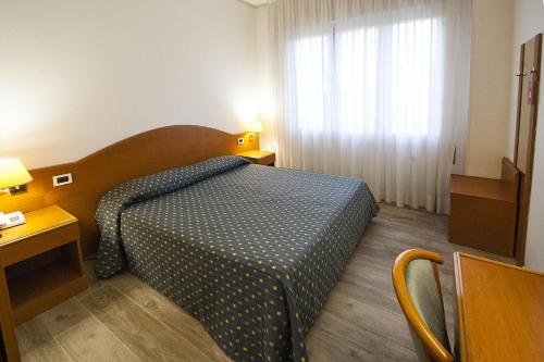 Posteľ alebo postele v izbe v ubytovaní Hotel Italia