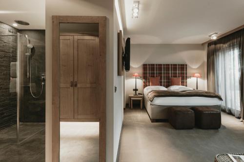 Postel nebo postele na pokoji v ubytování Eco & Wellness Boutique Hotel Sonne