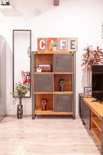a room with a shelf with drawers at Parliament & River View Apartments in Bucharest