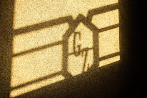 a shadow of a window on a wall at Golden Zaan Hotel, Zaandam-Amsterdam in Zaandam