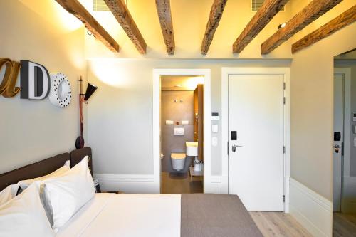 מיטה או מיטות בחדר ב-My Story Hotel Rossio