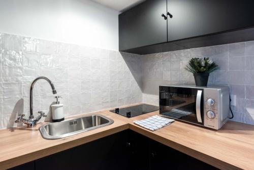 Η κουζίνα ή μικρή κουζίνα στο Architect's Duplex - Haut Marais