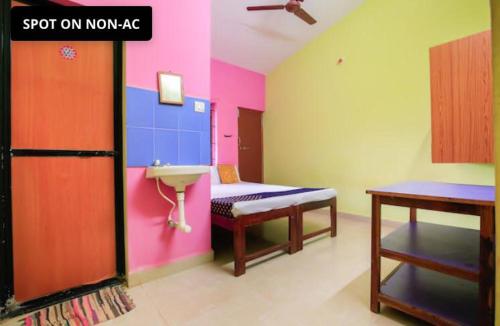 a room with a bathroom with a sink and a sink at Gods gift guesthouse in Arambol
