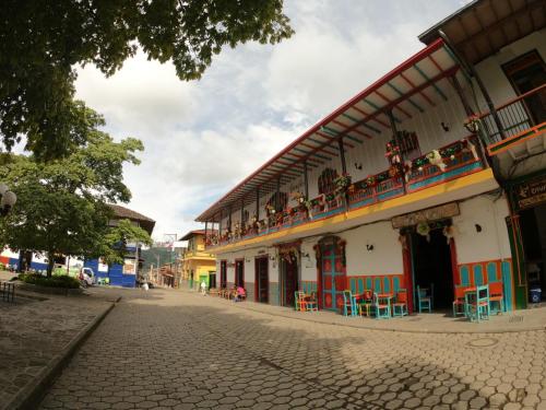 a building with chairs and tables on a street at Jardín by Bernalo Hotels in Jardin