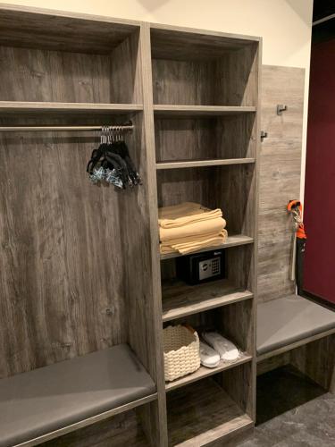 a wooden book shelf in a room at Chalet Mirandum Apartments Vandans in Vandans