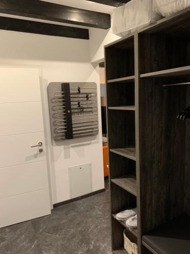 a room with a closet with a fan at Chalet Mirandum Apartments Vandans in Vandans