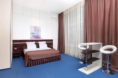 Posteľ alebo postele v izbe v ubytovaní Аrt-Volzhskiy
