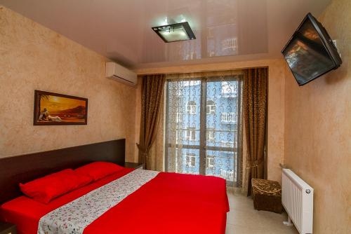 En eller flere senge i et værelse på Hotel Nika