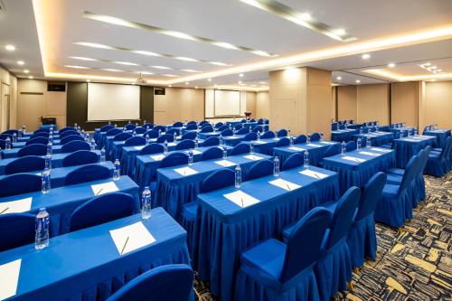 a conference room with blue tables and chairs in it at Holiday Inn Express Shenyang North Station by IHG in Shenyang