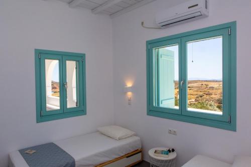Säng eller sängar i ett rum på Azaland Naxos